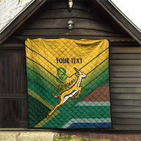 Custom rugby quilt in green-yellow-blue-brown with rugby player logo and “YOUR TEXT”