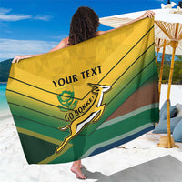 Green and yellow striped rugby sarong with Bokke emblem and custom text, draped