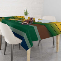 Green tablecloth with multicolor diagonal stripes and patterned border
