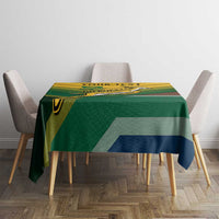 Green tablecloth with yellow and blue diagonal stripe design on table
