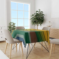 Green tablecloth with multicolor geometric stripes and African pattern