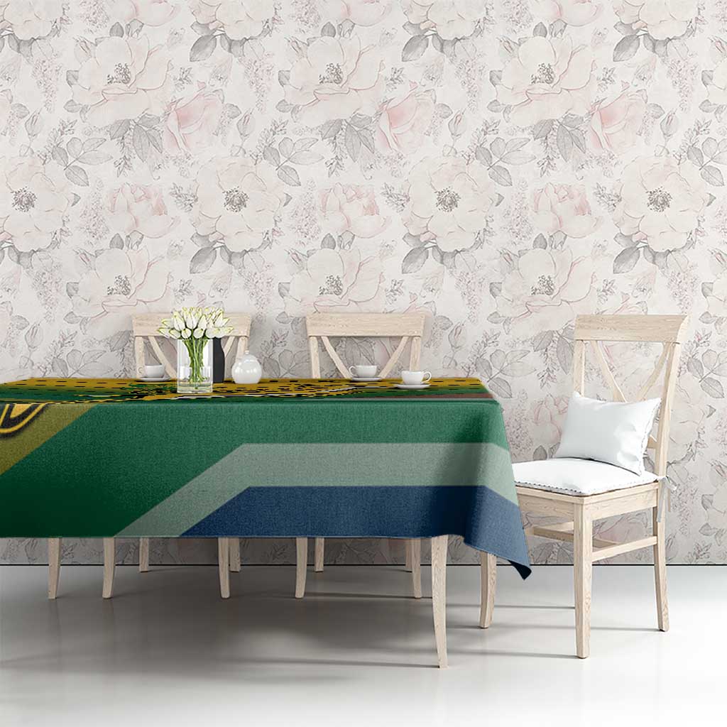 Green tablecloth with yellow, blue, and brown diagonal stripe pattern