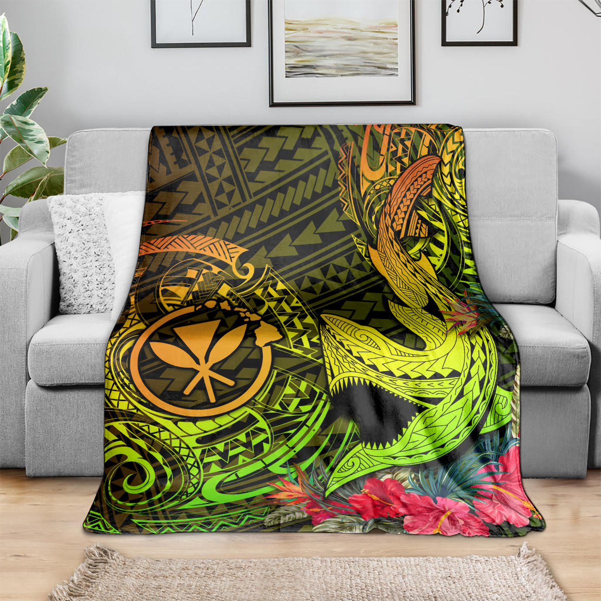 Polynesian shark tattoo blanket draped on sofa, neon green and yellow with pink flowers