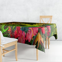 Rectangular tablecloth with bright green tropical leaves, red flowers, and dark abstract motifs