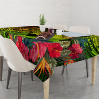 Tablecloth featuring vivid green swirls, red hibiscus-style blooms, and tropical leaf print