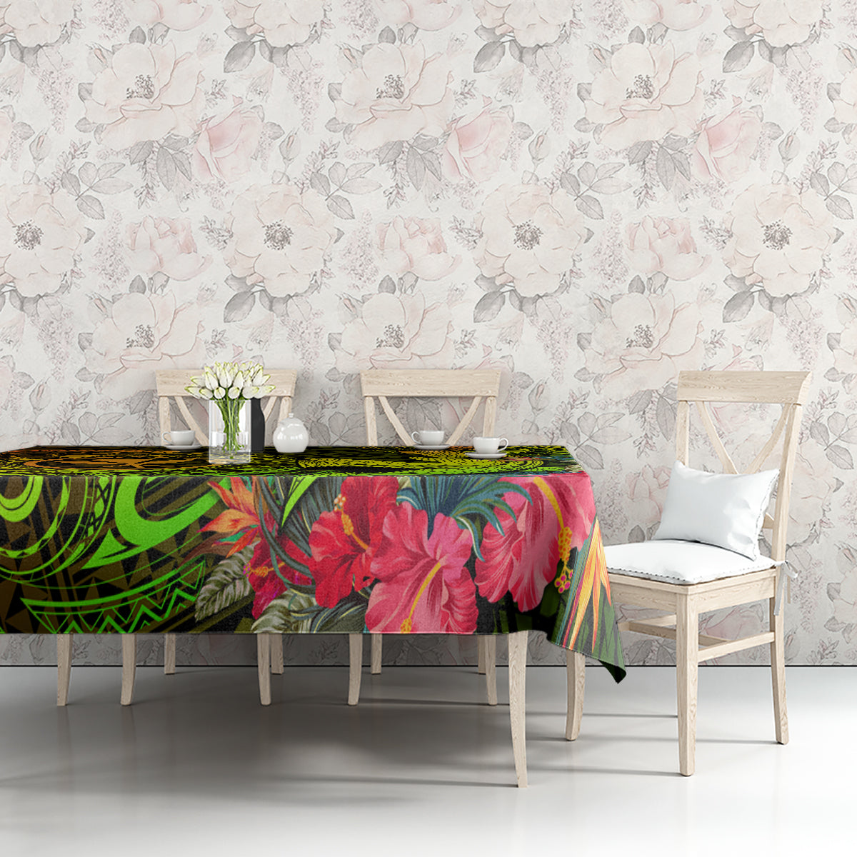 Tropical tablecloth with green swirls, red floral print, and dark tribal-style accents