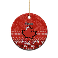 Red Canada ceramic Christmas ornament, round disc with maple leaf and Noel holiday pattern
