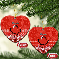 Red Canada ceramic Christmas ornament, heart shape with maple leaf and Noel holiday pattern
