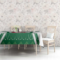 Green Algeria emblem tablecloth on dining table in a room with floral wall decor