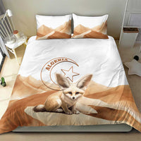 White duvet and two pillowcases with large fox crouching graphic and tan wave background