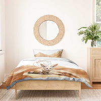 White bedding set with tan fox graphic across duvet and pillow, styled on light wood bed