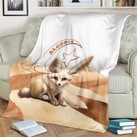Algeria Sahara blanket with dog illustration and Algeria crest, folded on couch
