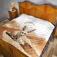 Quilt bedspread with white diamond quilting, tan sections, and centered fennec fox logo