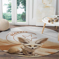 Round carpet rug with fennec fox portrait and star graphic, Algeria text, tan and white