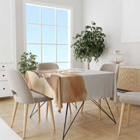 White tablecloth with fennec fox print running along the tabletop edge.