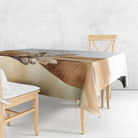 Fennec fox tablecloth in white with tan desert print, shown on a tabletop and bench.