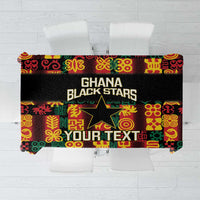 Black tablecloth with colorful Adinkra pattern and Ghana Black Stars text