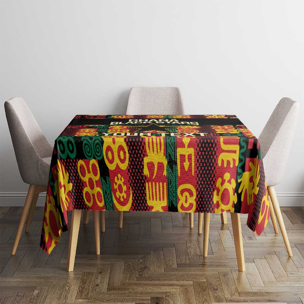 Black tablecloth with Ghana Black Stars banner and colorful Adinkra motifs
