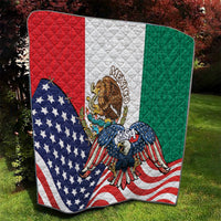 Quilt laid outdoors with red, white, and green sections, eagle in the center