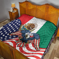 Quilt on a bed with red, white, and green panels, blue eagle, and diagonal stars