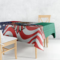 Printed tablecloth with red-and-white stripes, blue stars, and green Aztec-style panels