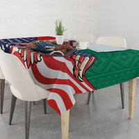 Printed tablecloth draped over dining table with eagle, blue stars, red stripes, and green panel