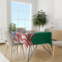 Printed tablecloth across dining table with blue stars, red stripes, and green Aztec pattern
