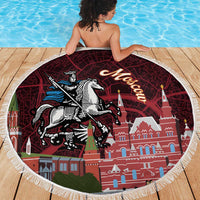 Round red beach blanket with fringe edge, Moscow skyline and knight-on-horse print