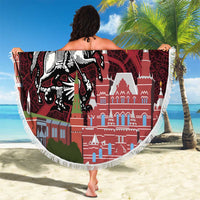 Circular red beach blanket with fringe edge, Moscow walls and knight-on-horse graphic