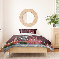 Red bedspread and pillow shams with Moscow skyline map art and knight-on-horse center