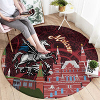 Round red Moscow-themed rug featuring horse rider, Kremlin towers, and a map-style pattern