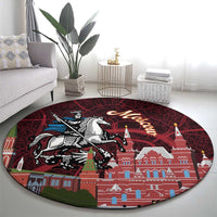 Round red patterned rug with Moscow landmark artwork, horse rider and city walls