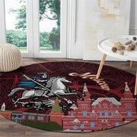 Red circular rug with Moscow skyline illustration, horse rider graphic, and tower buildings