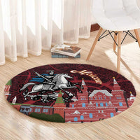 Round red Moscow city rug with horse rider image and Kremlin-like towers across the center