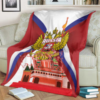 Red blanket with Russia coat of arms and St Basil cathedral print, draped on armchair