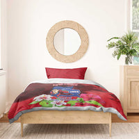 Red duvet cover and one pillow with mountain crest and pink flowers on bed