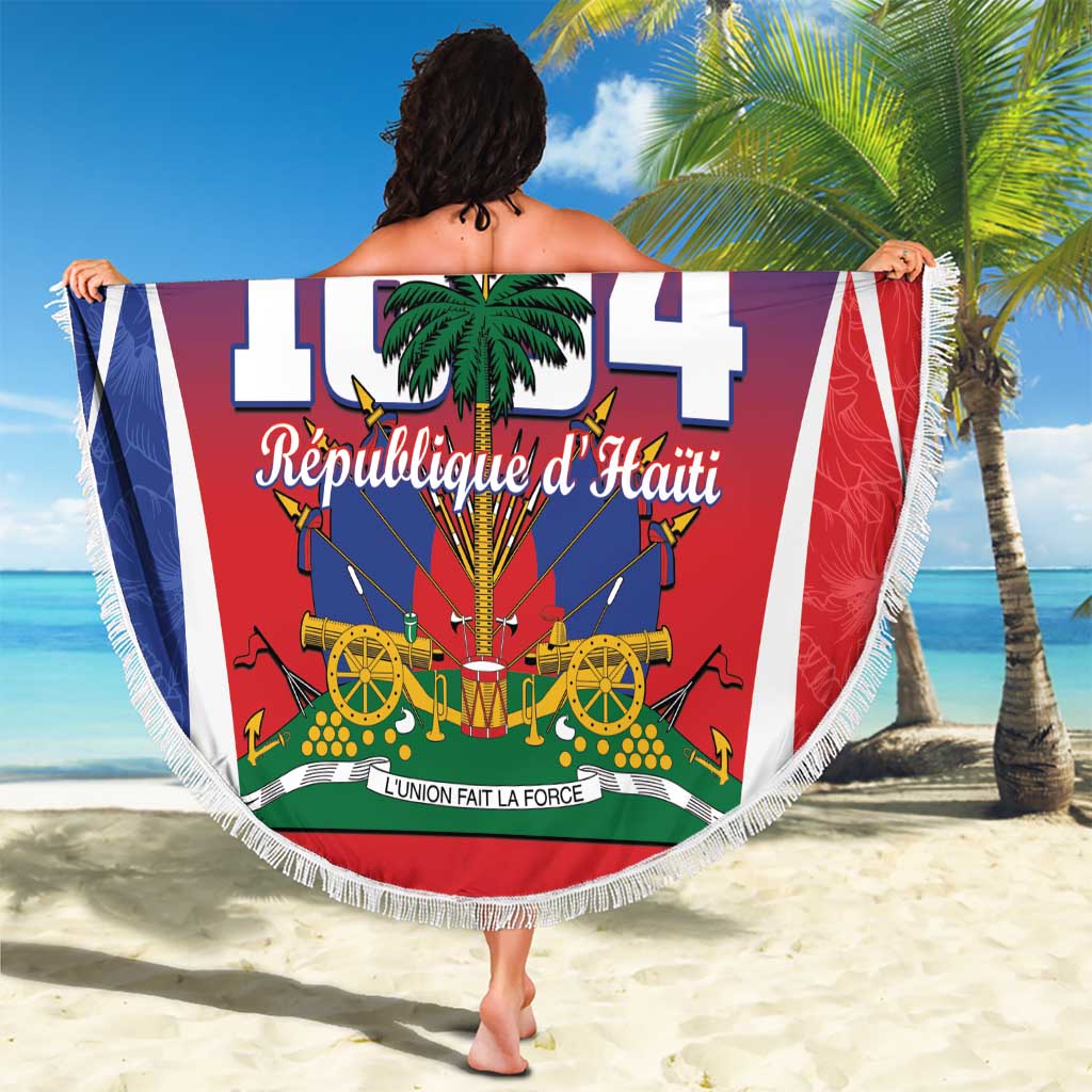 Round blue fringe beach blanket with Haiti 1804 graphic and 'Your Text' held outdoors