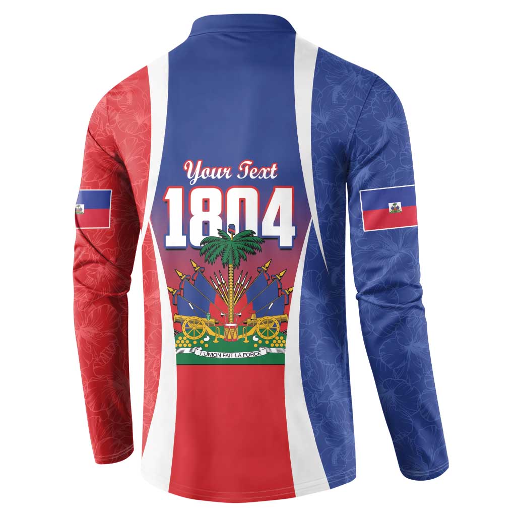 Blue button sweatshirt with Haitian flag paneling and bold "1804" graphic