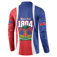 Blue button sweatshirt with Haitian flag paneling and bold "1804" graphic