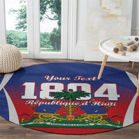 Round personalized Haiti 1804 carpet with blue, red, and gray printed design.