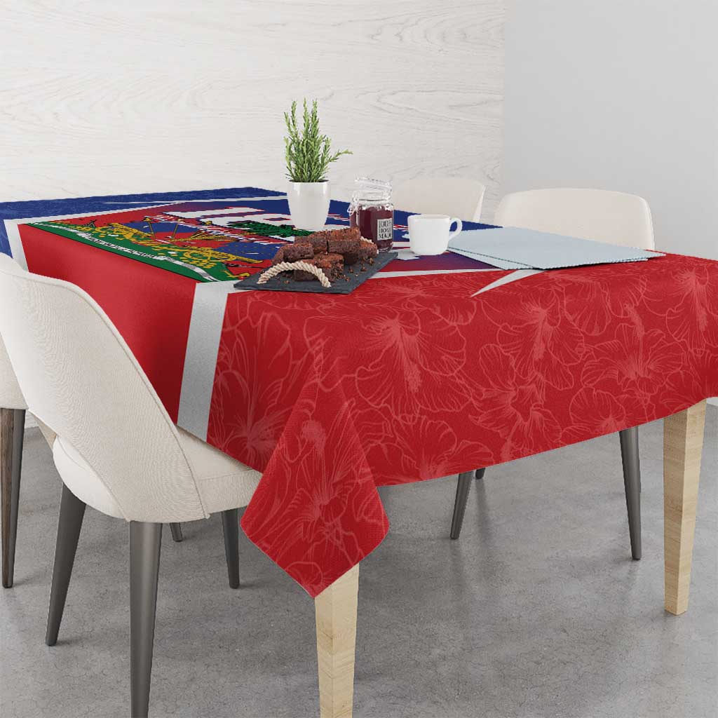 Red patterned tablecloth with white border and blue-and-green center Haiti design