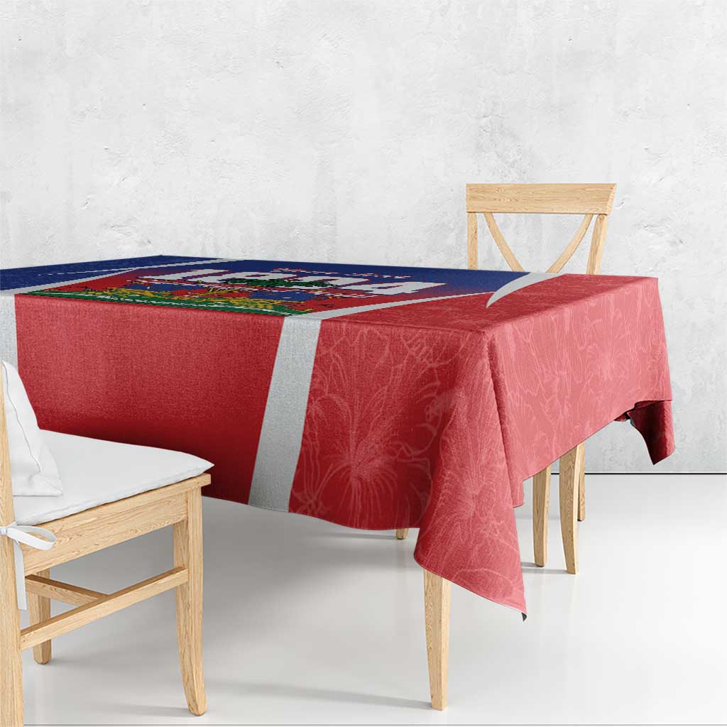 Rectangular tablecloth with red patterned fabric, white border stripe, and Haiti-themed corner