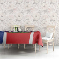 Haiti-themed tablecloth with red center, blue edge, and white stripe border on dining table