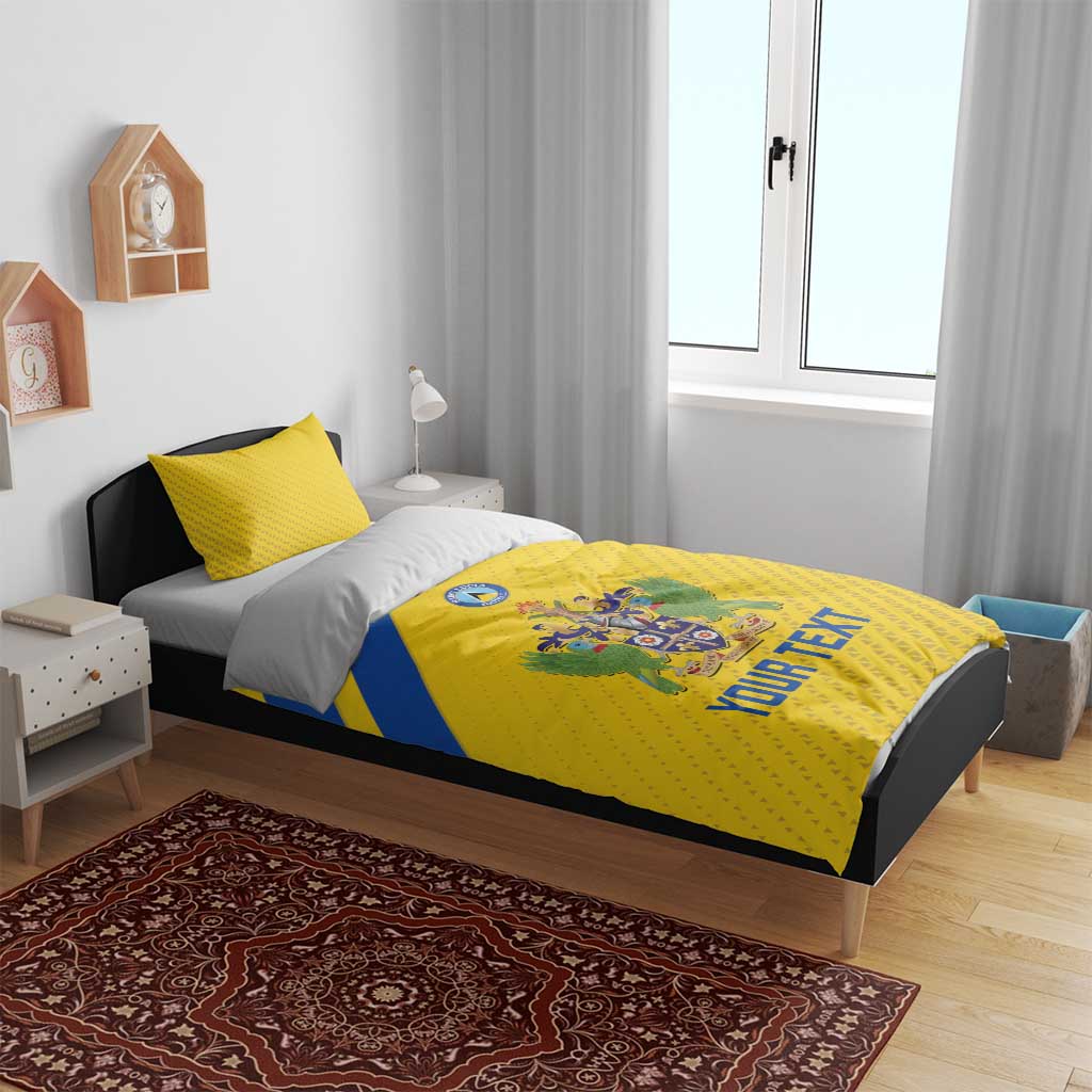 Yellow football bedding set with crest emblem, blue stripe, and 'YOUR TEXT' on duvet