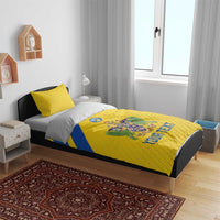 Yellow football bedding set with crest emblem, blue stripe, and 'YOUR TEXT' on duvet