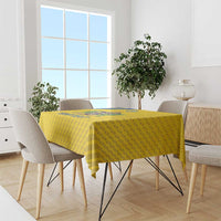 Yellow football tablecloth with geometric triangle pattern on dining table
