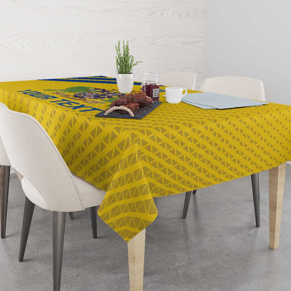 Yellow football tablecloth with geometric pattern and blue logo detail at center
