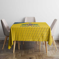 Yellow football tablecloth with 'YOUR TEXT' and geometric pattern on table