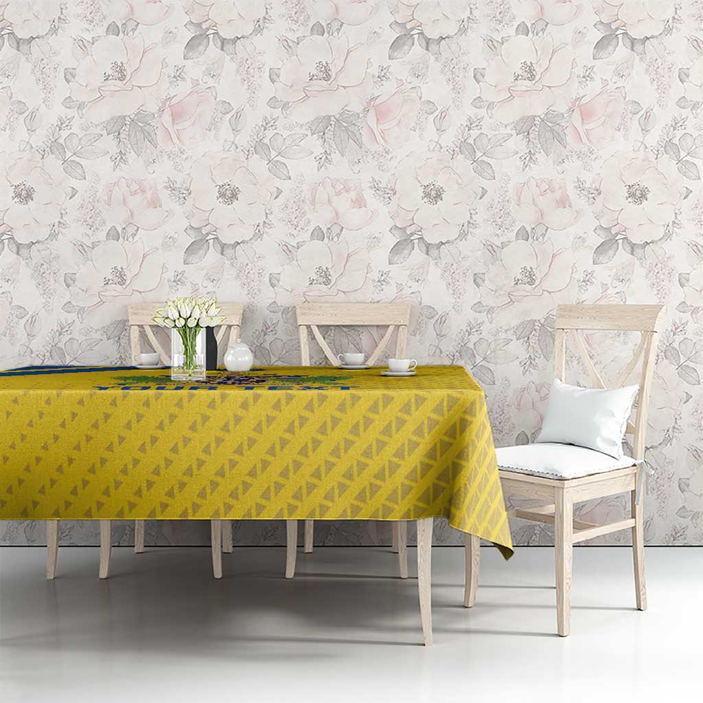 Yellow football tablecloth on dining table with matching chairs