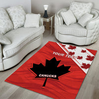 Red rugby area rug with maple-leaf emblem and 'YOUR TEXT' banner, 'CANUCKS' center